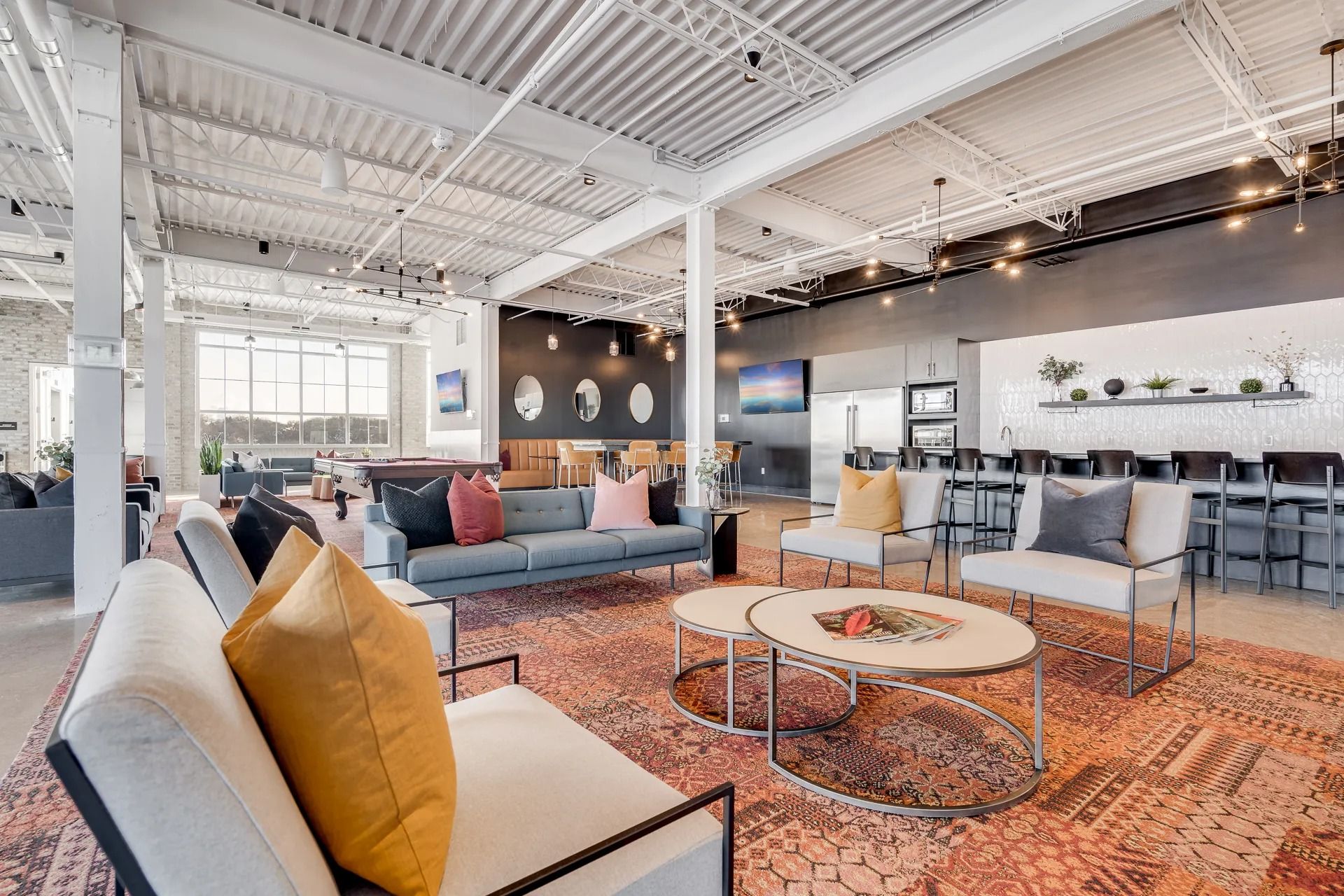 View of lounge seating with couches inside apartment resident club room