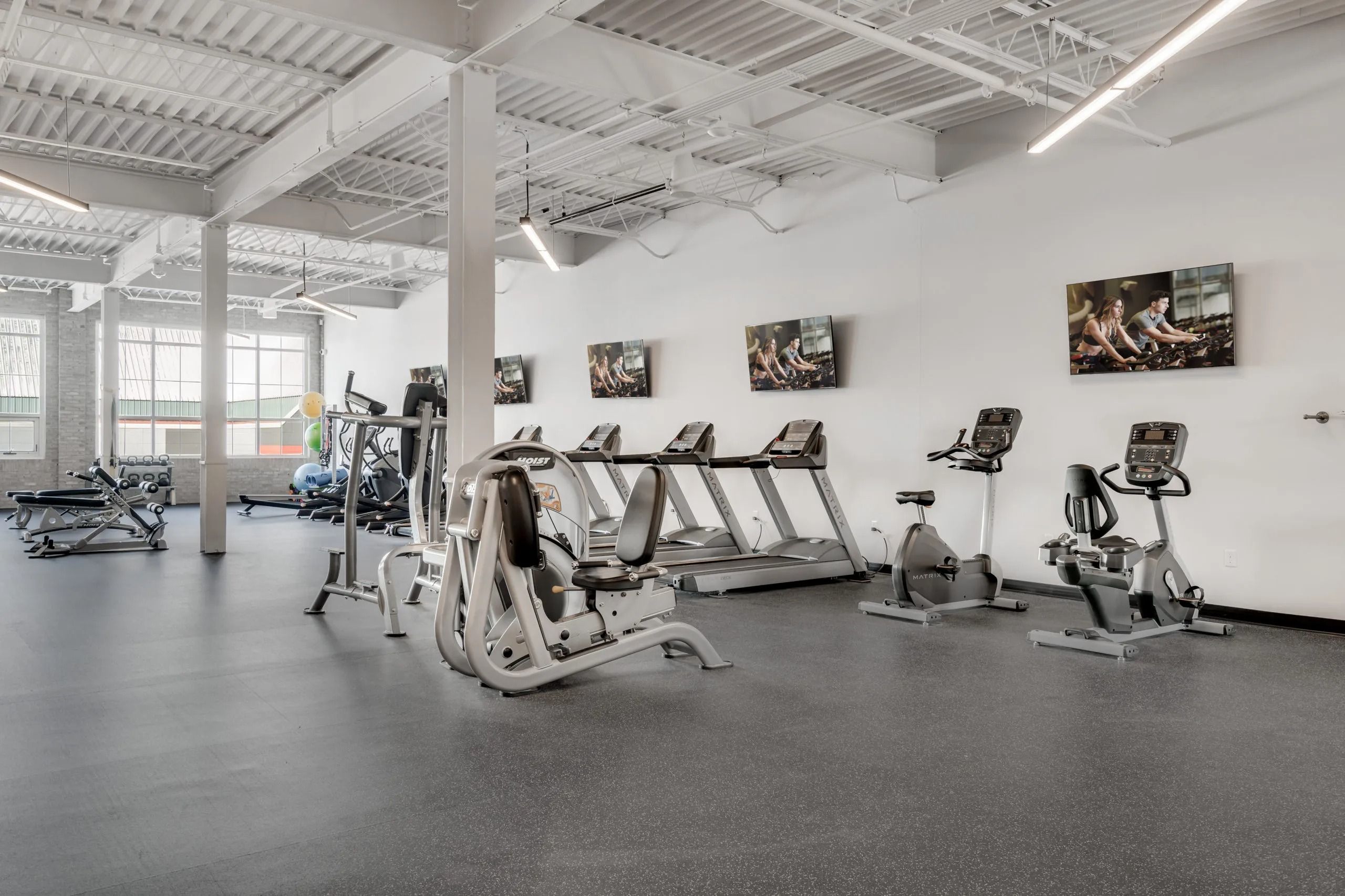 fitness center with treadmills and functional training equipment inside MAX apartments for University of Minnesota faculty and graduate students