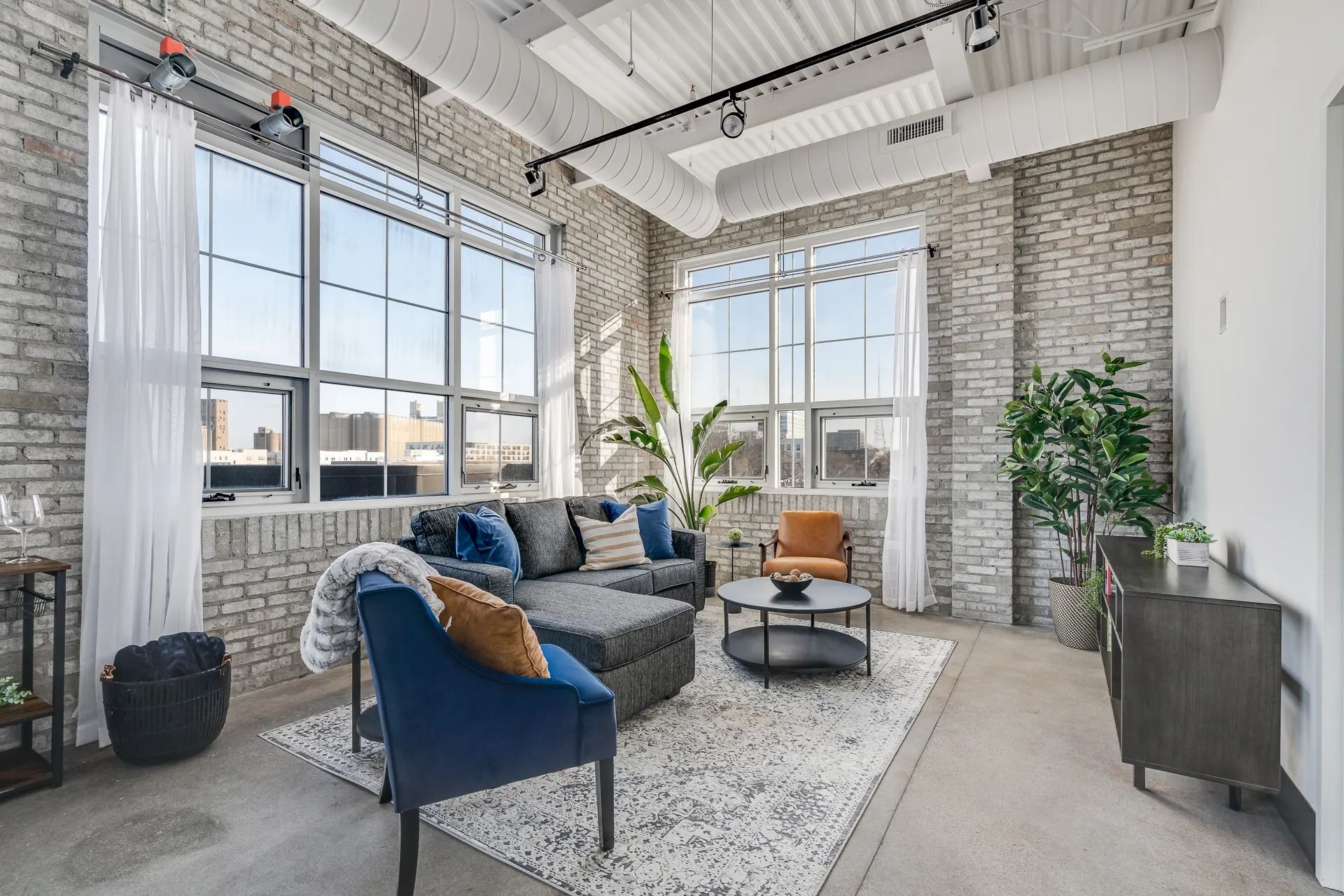Beautiful warehouse conversion apartment with exposed brick, extra large windows, and high ceilings